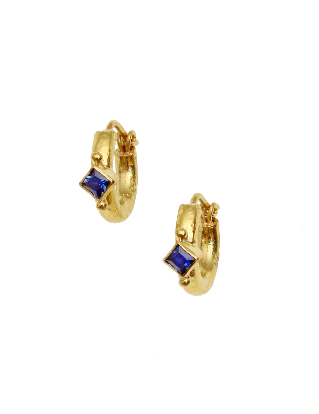 Baby hammered hoops with blue sapphire set en pointe.